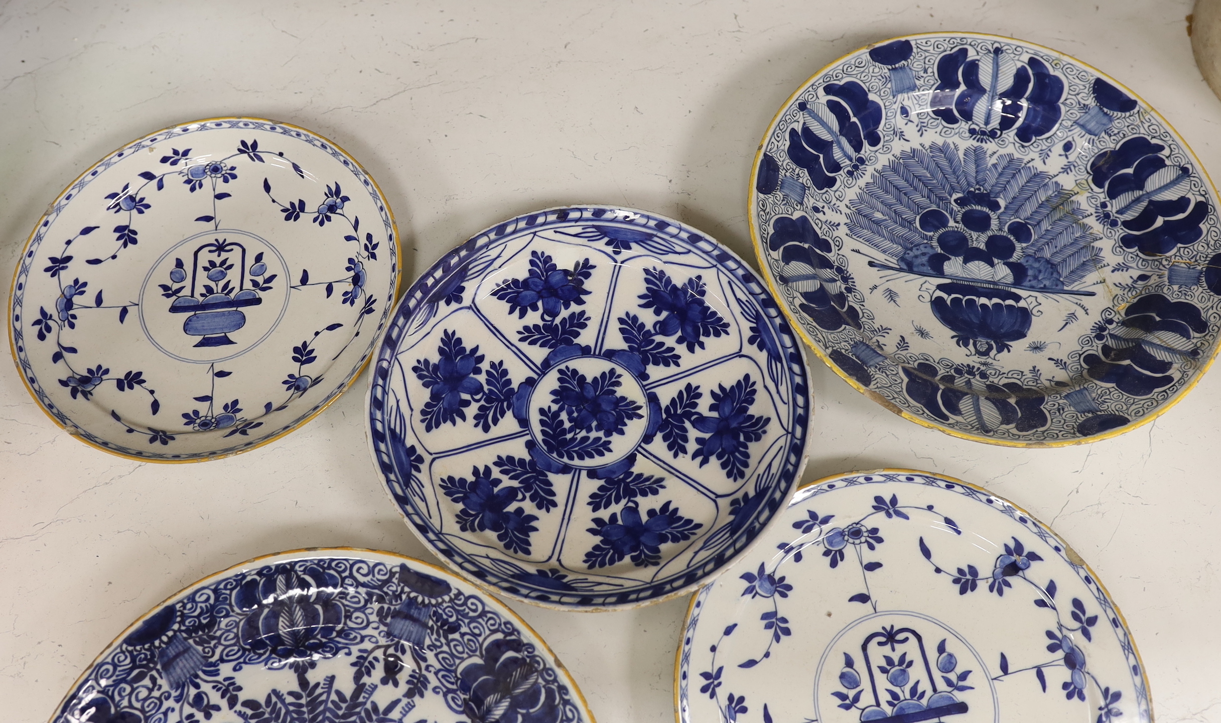 Five 18th century Delft blue and white plates, largest 31cm